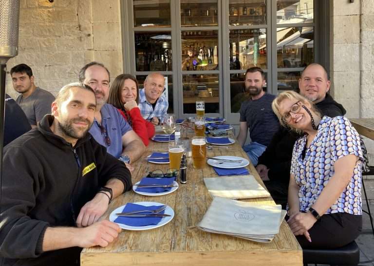 Office team enjoying a group lunch together