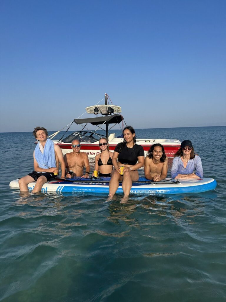 Interns and CWC team members sharing a thrilling water skiing experience